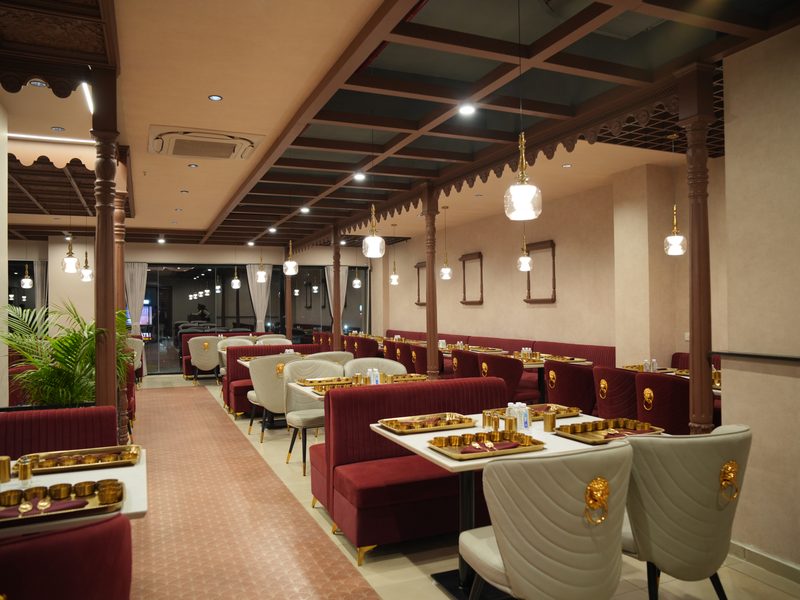 Rotlo Gota — carved wooden interior with maroon booths